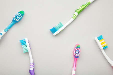Toothbrushes on a gray background. Oral care