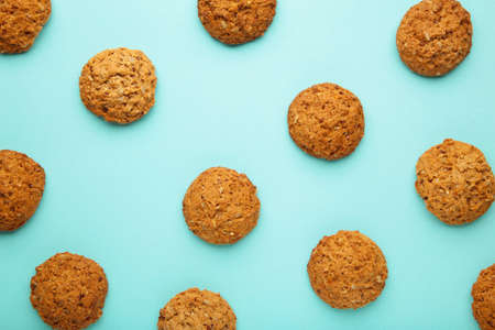 Many oats biscuits on a blue background. Top view