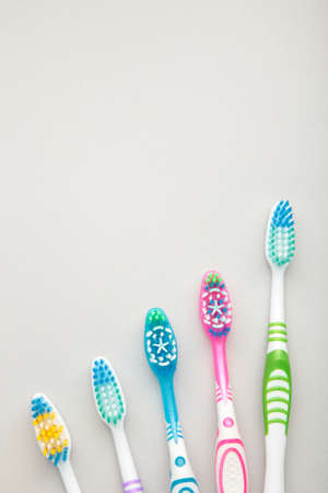 Toothbrushes on gray background with copy space. Top viewの写真素材