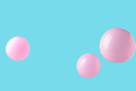 Pink pastel baloons on pink background. Minimalism. Top view