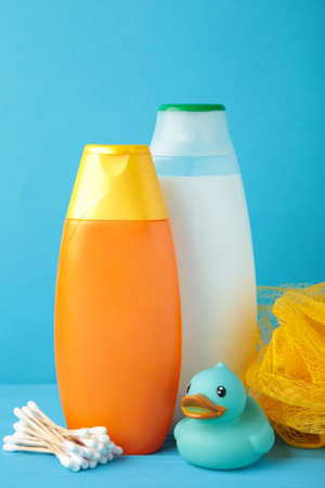 Toiletries baby on blue background. Baby shower gel. Top viewの写真素材