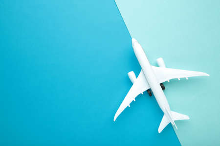 Model airplane on blue pastel color background. Travel conceptの写真素材