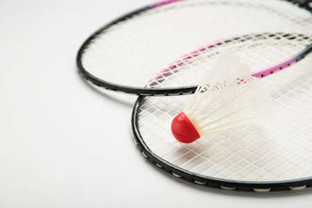 Shuttlecocks and badminton rackets on gray background. Top view.の写真素材