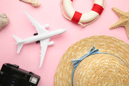 Traveler accessories on pink background. Travel vacation concept. Summer background.の写真素材