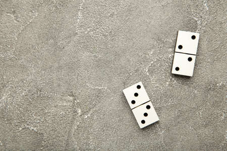 Domino pieces on the gray background. Top view
