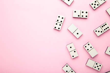 Domino pieces on the pink background. Top viewの写真素材