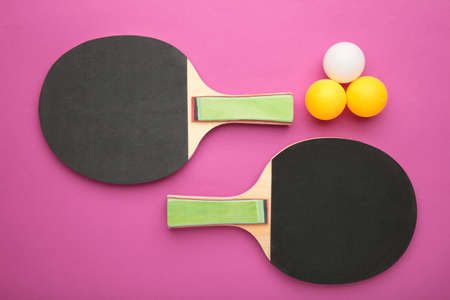 rackets and balls on pink background. Top viewの写真素材