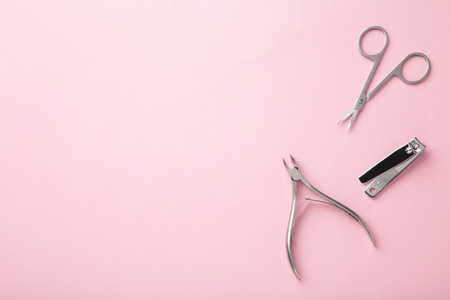 Tools of a manicure set on pink background. Top viewの写真素材