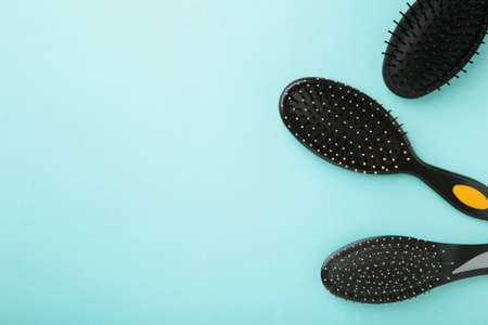 Hair tools, beauty and hairdressing concept - different brushes or combs on blue backgroundの写真素材