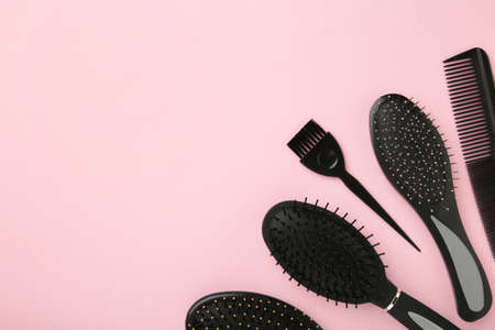Hair tools, beauty and hairdressing concept - different brushes or combs on pink background. Top viewの写真素材