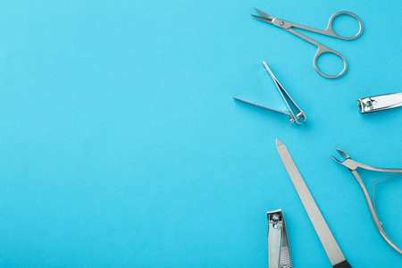 Tools of a manicure set on blue background. Top viewの写真素材