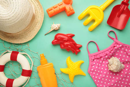 Summer beach toys with accessories on mint background. Top viewの写真素材