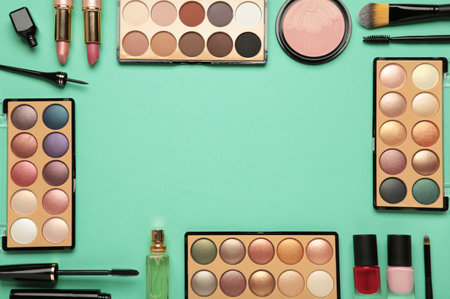 Different luxury makeup products on mint background, flat lay. Top viewの写真素材