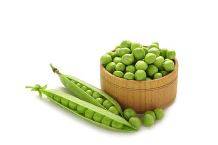 Fresh green peas in bowl isolated on white background. Top viewの写真素材