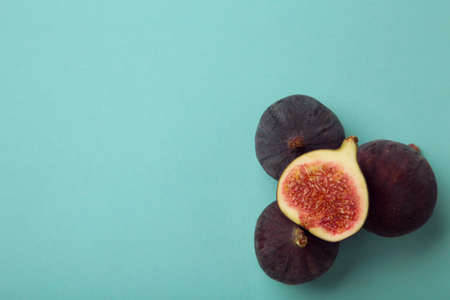 Fresh ripe figs on blue background. Top view.の写真素材
