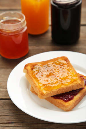 Sweet toasts with jam for breakfast on gray. Top viewの写真素材