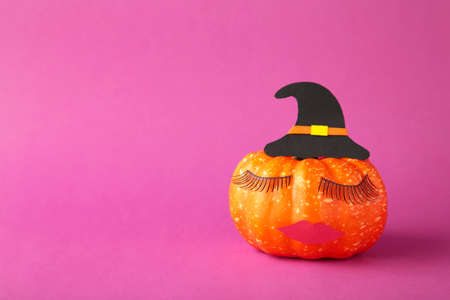 Halloween pumpkin with make up. Minimal Holiday season concept background. top viewの写真素材