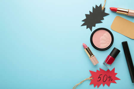 Set of cosmetics for sale on Black Friday on blue background. Top viewの写真素材