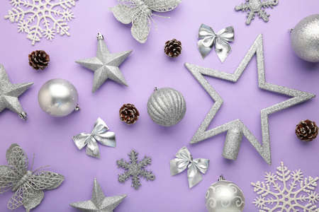 Christmas silver baubles on purple background with copy space. New Year compositionの写真素材