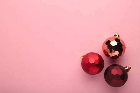 Red christmas ball on pink background. New Year composition. Top viewの写真素材