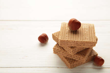 Chocolate wafers on white background with hazelnut Top viewの写真素材
