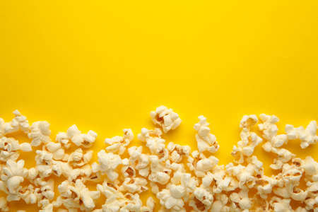 Popcorn on yellow background with copy space. Top viewの写真素材