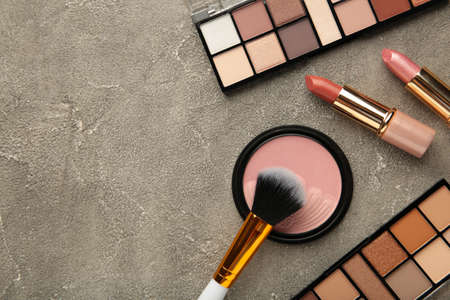 Set of decorative cosmetics on gray background. Top viewの写真素材