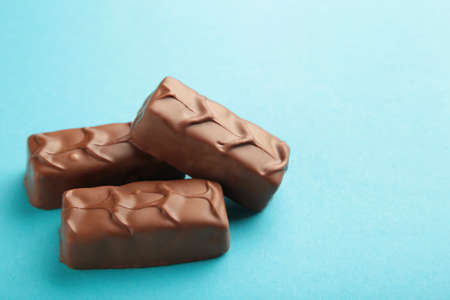 Chocolate bars on blue background.