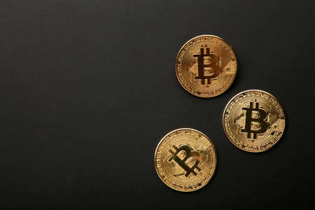 Bitcoin coin black background. Bitcoin growth and investment concept. top view
