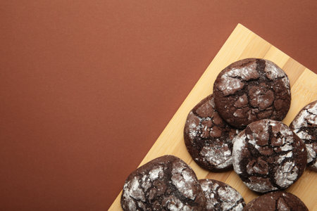 Soft dark chocolate brownie cookies on cutting board. top viewの写真素材
