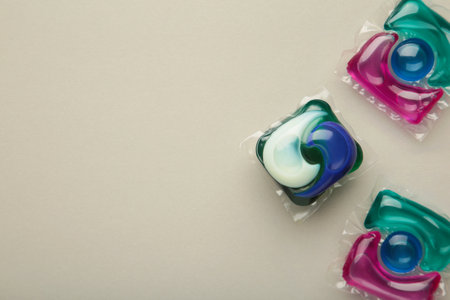 Laundry capsule detergent pods for washing clothes on gray background. top viewの写真素材