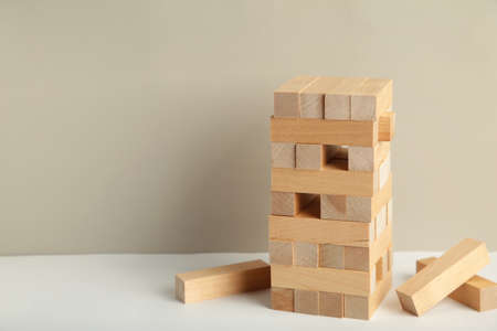 Blocks of wood on gray background, Strategy game as a business plan for team work. Space for textの写真素材