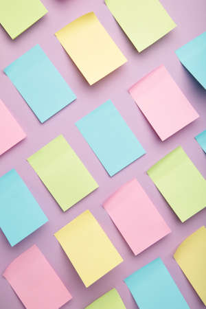 Colorful sticky notes on purple background. top viewの写真素材