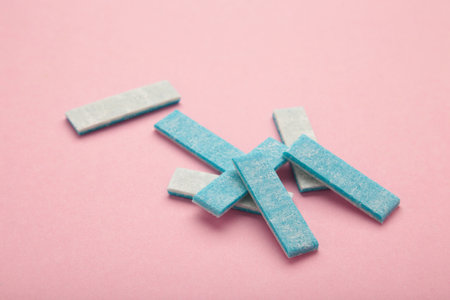 Mint chewing plates on pink background. top viewの写真素材