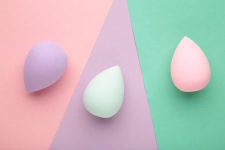 Beauty blender on colorful background. Bright sponges for make-up cosmetics. makeup products. beauty concept.の写真素材