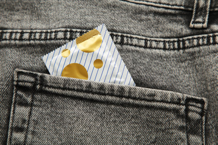 Condom in black jeans pocket, Protect yourself use a condom. top viewの写真素材