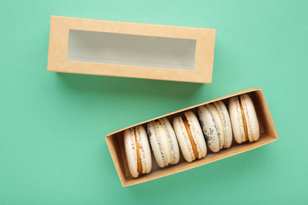 Macaroons box on mint background. top viewの写真素材