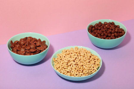 Set of various breakfast cereals on colorful background, top viewの写真素材