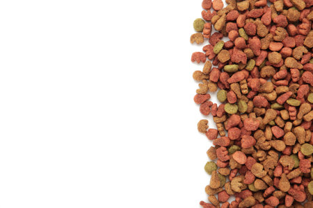 Dried cat food, shaped kitty kibble as an abstract background texture isolated on white background. top viewの写真素材