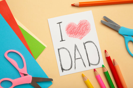 Greeting card for on Father's Day with inscription I love dad. handmade. Children's creativity project, crafts, crafts for kids. top viewの写真素材