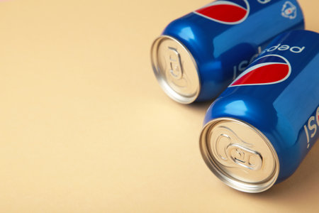Mykolaiv, Ukraine - May 2, 2023: Pepsi drink in a can on beige background. Pepsi is a carbonated soft drink produced by PepsiCo. top viewのeditorial素材
