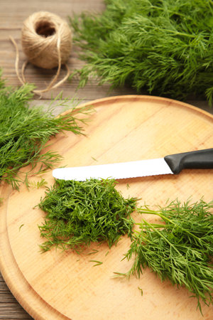Cut dill on cutting board on gray background. top viewの写真素材