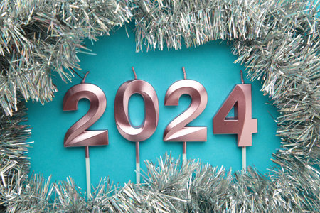 2024 Happy New Year and Christmas decoration on blue background. Top view