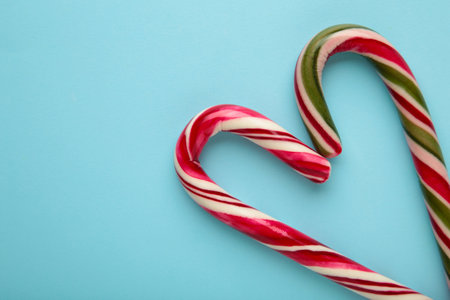 Nice christmas candy heart on blue background. Top viewの写真素材