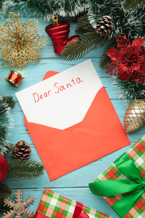 Dear Santa - letter to Santa Claus with Christmas toys on blue background. Top viewの写真素材