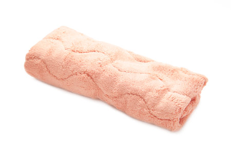 Pink soft towel isolated on white background. Top view