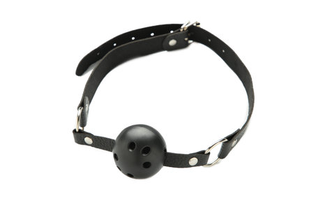 Ball gag in mouth isolated on white background. Intimate toys. Sex abuse slavery.の写真素材
