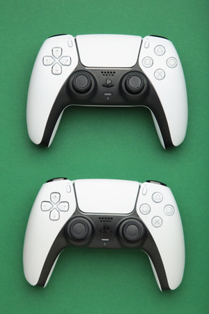 Mykolaiv, UKRAINE - July, 2024: New product from Sony, gamepad on green background, game controller