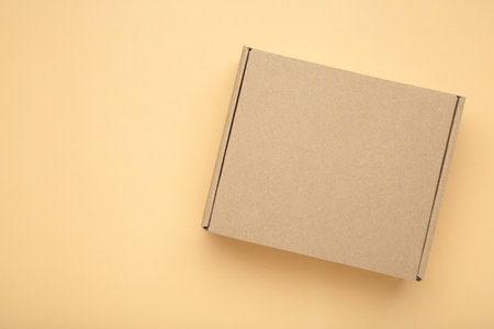 Brown Paper box Cardboard box on beige background. Top viewの写真素材