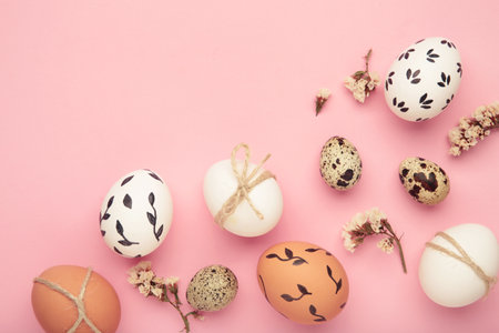 Composition with Easter eggs on pink background. Space for text